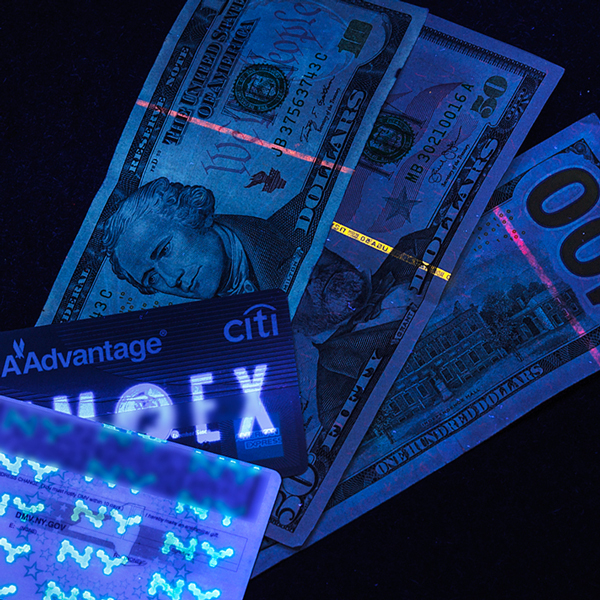 Currency, Credit Card, and license glowing under Sunlite Led True Blacklight Blue UV-A A19 Light